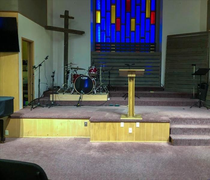 Church altar damaged by water within the carpet